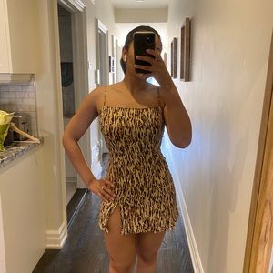 Sunday best cheeta print mini dress with leg slit.